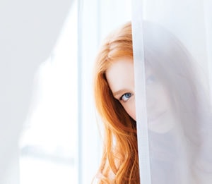 woman-hidding-curtain woman hidding curtain